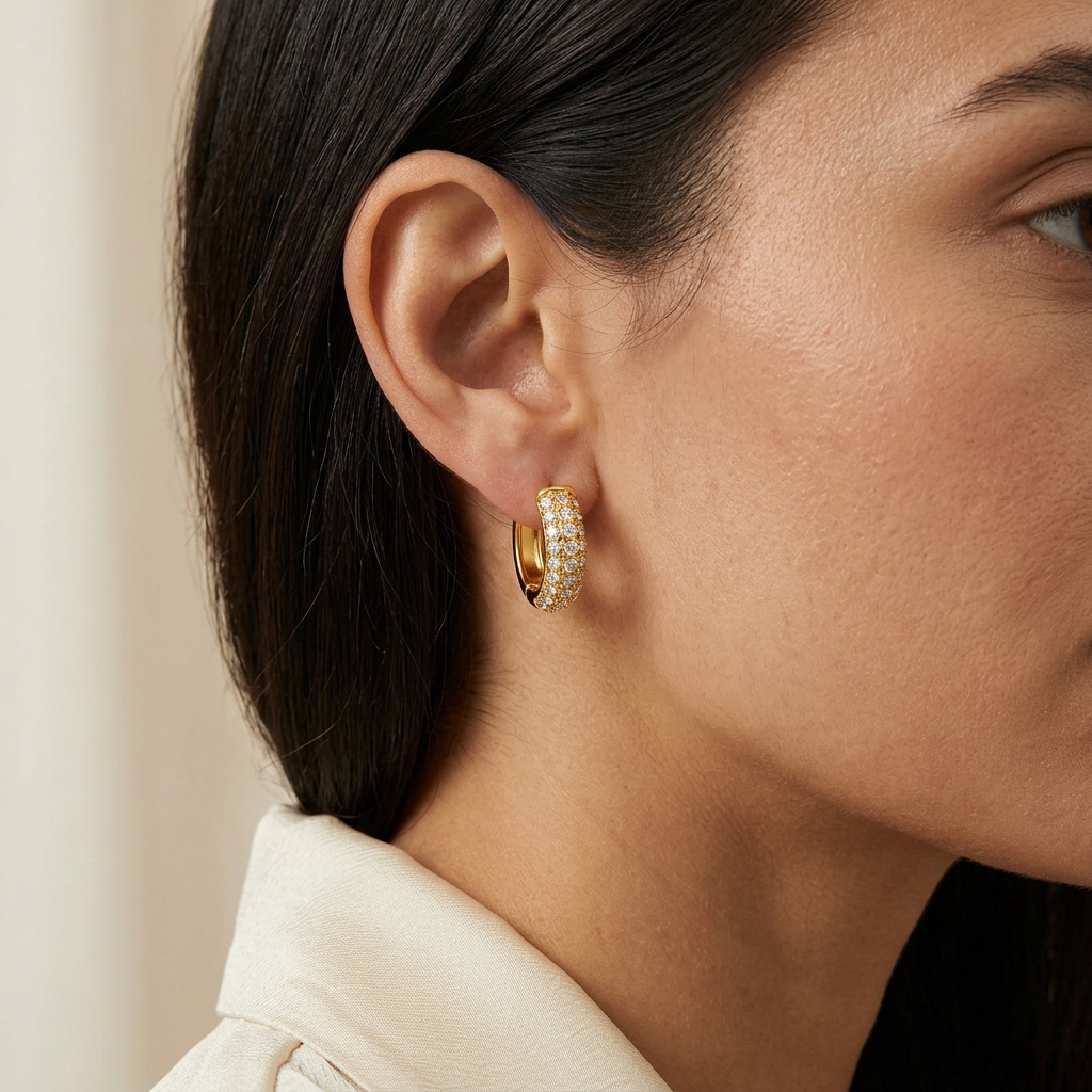 Glow gold-plated hoop worn on an ear