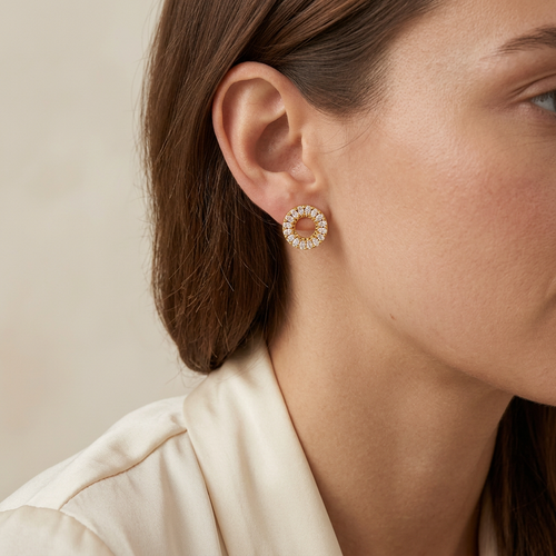Halo stud earring worn on an ear