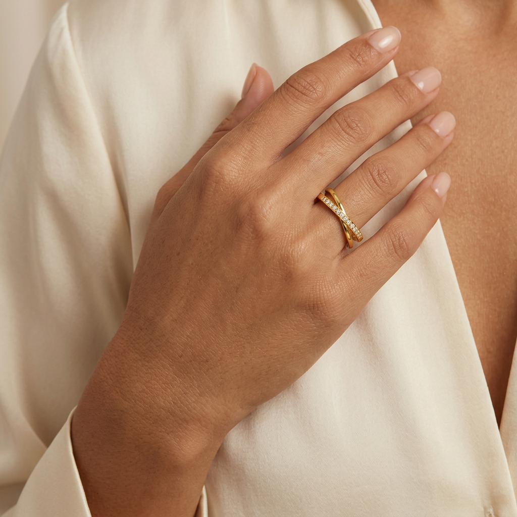 Interlace gold-plated ring worn on a hand