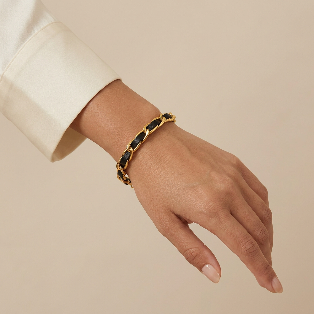 Noir bracelet worn in an angled wrist close-up