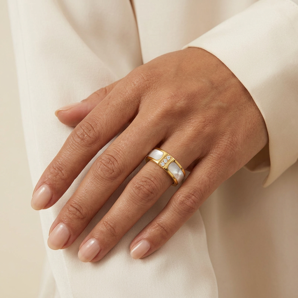 Sheen gold-plated ring worn on a hand